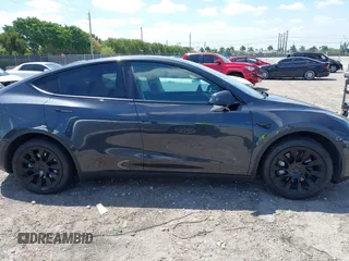 2024 Tesla Model Y with VIN 7SAYGDED3RF019063, listed as a IAAI auction lot 42061888 with 13,763 mi miles and . Bid and sale history available at DreamBid. Image 12.