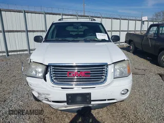 2006 GMC Envoy SLT with VIN 1GKDS13S062128531, listed as a IAAI auction lot 41458983 with 119,385 mi miles. Bid and sale history available at carsss.com. Image 12.