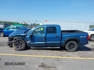 2005 Dodge Dakota SLT with VIN 1D7HW48N05S319621, listed as a IAAI auction lot 42037140 with 251,595 mi miles and . Bid and sale history available at DreamBid. Image 14.