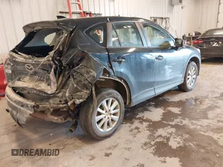 2015 Mazda CX-5 Sport with VIN JM3KE4BY0F0542655, listed as a IAAI auction lot 41471568 with 165,386 mi miles. Bid and sale history available at carsss.com. Image 4.
