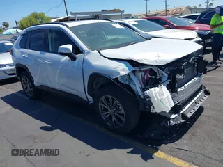 2023 Toyota RAV4 Hybrid XLE Premium with VIN JTMB6RFV0PD087237, listed as a IAAI auction lot 42606802 with 16,872 mi miles and . Bid and sale history available at DreamBid. Image 1.