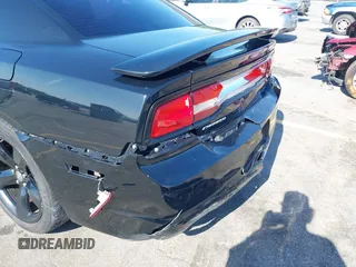 2012 Dodge Charger SXT with VIN 2C3CDXHG2CH258844, listed as a IAAI auction lot 42025908 with 214,529 mi miles. Bid and sale history available at carsss.com. Image 6.
