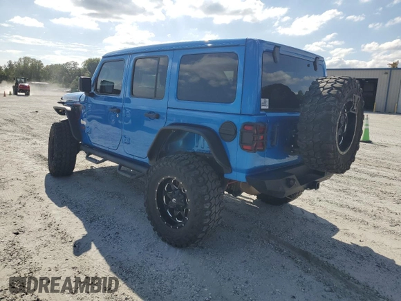 2023 Jeep Wrangler Rubicon with VIN 1C4HJXFN5PW504658, listed as a Copart auction lot 69063484 with 32,490 mi miles and Salvage title. Bid and sale history available at DreamBid. Image 2.