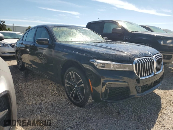 2020 BMW 7 Series 750i xDrive with VIN WBA7U2C0XLGM27270, listed as a Copart auction lot 77241404 with 68,998 mi miles and Salvage Title. Bid and sale history available at carsss.com. Image 4.