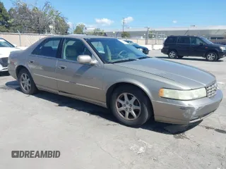 2002 Cadillac Seville Luxury SLS z VIN 1G6KS54Y92U207873, wystawiony jako IAAI lot #41957595 z przebiegiem 118 580 mil mil oraz . Historia ofert i sprzedaży dostępna na DreamBid. Obrazek 1.