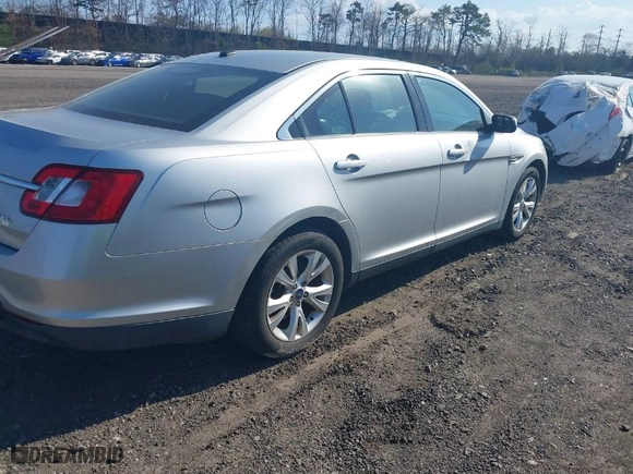 2010 Ford Taurus SEL with VIN 1FAHP2EW2AG107489, listed as a IAAI auction lot 39206067 with 128135 miles. Bid and sale history available at carsss.com. Image 4.