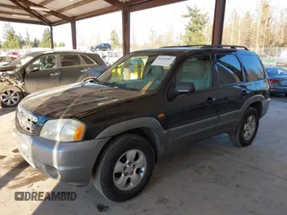 2002 Mazda Tribute LX with VIN 4F2CU08172KM58561, listed as a IAAI auction lot 41435407 with 141,908 mi miles and . Bid and sale history available at carsss.com. Image 2.