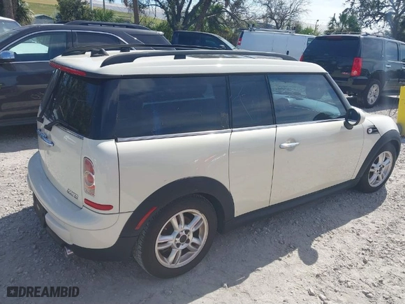 2013 MINI Cooper Clubman with VIN WMWZF3C57DT571338, listed as a IAAI auction lot 41367674 with 77,628 mi miles. Bid and sale history available at carsss.com. Image 4.