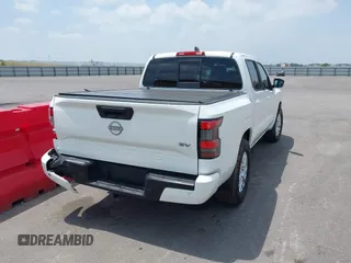2022 Nissan Frontier SV z VIN 1N6ED1EJXNN693314, wystawiony jako IAAI lot #42322104 z przebiegiem 52 565 mil mil oraz . Historia ofert i sprzedaży dostępna na DreamBid. Obrazek 4.