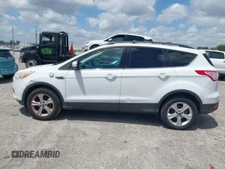 2013 Ford Escape SE with VIN 1FMCU0GX0DUC79223, listed as a IAAI auction lot 42077240 with 158,141 mi miles and . Bid and sale history available at DreamBid. Image 14.