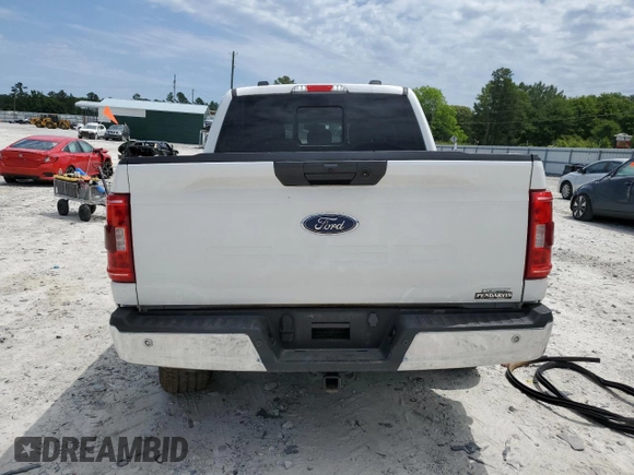 2023 Ford F-150 XL with VIN 1FTFW1E85PKG17275, listed as a Copart auction lot 57497155 with 34,379 mi miles and Salvage title. Bid and sale history available at DreamBid. Image 6.