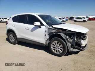 2016 Mazda CX-5 Touring with VIN JM3KE2CY7G0657113, listed as a Copart auction lot 46489835 with 166,399 mi miles and Salvage Title. Bid and sale history available at DreamBid. Image 4.