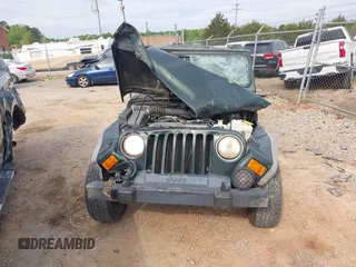 2004 Jeep Wrangler X z VIN 1J4FA39S84P714902, wystawiony jako IAAI lot #42011039 z przebiegiem Nie podano mil oraz . Historia ofert i sprzedaży dostępna na DreamBid. Obrazek 11.