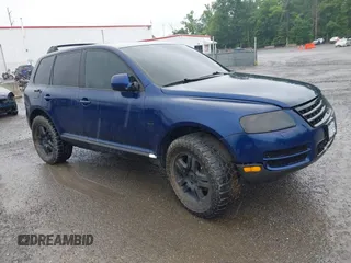 2004 Volkswagen Touareg z VIN WVGCM67L24D026100, wystawiony jako IAAI lot #42318557 z przebiegiem Nie podano mil oraz . Historia ofert i sprzedaży dostępna na DreamBid. Obrazek 1.