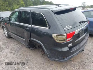 2011 Jeep Grand Cherokee Laredo with VIN 1J4RS4GG7BC569287, listed as a IAAI auction lot 41915092 with 211,148 mi miles and . Bid and sale history available at DreamBid. Image 3.