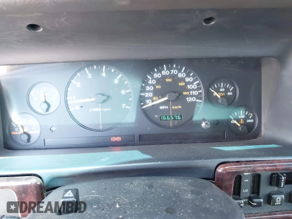 1998 Jeep Grand Cherokee Limited z VIN 1J4GZ88Z4WC328450, wystawiony jako IAAI lot #42652126 z przebiegiem 166 576 mil mil oraz . Historia ofert i sprzedaży dostępna na DreamBid. Obrazek 7.