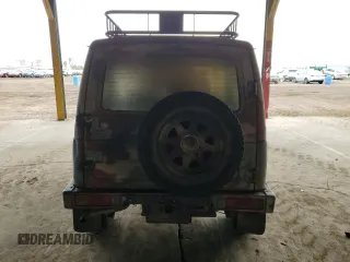 1986 Suzuki Samurai z VIN JS3JC51V1G4101572, wystawiony jako Copart lot #82712734 z przebiegiem Nie podano mil oraz Szkody całkowita. Historia ofert i sprzedaży dostępna na DreamBid. Obrazek 6.