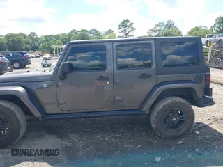 2017 Jeep Wrangler Unlimited Sahara with VIN 1C4BJWEG4HL605213, listed as a IAAI auction lot 42247221 with 104,542 mi miles and . Bid and sale history available at DreamBid. Image 14.