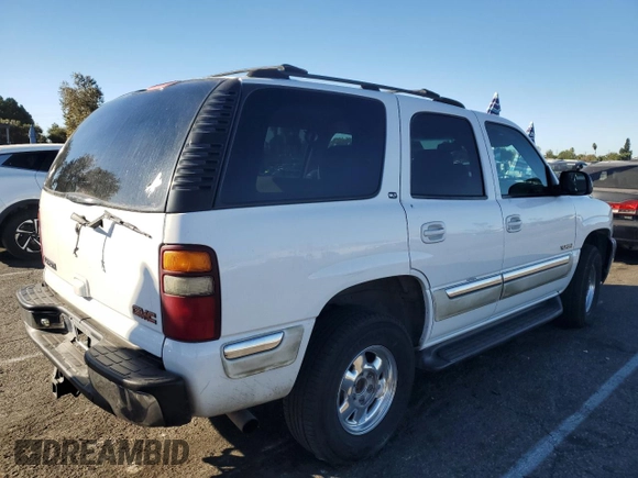 2001 GMC Yukon SLT with VIN 1GKEC13T61R225145, listed as a Copart auction lot 79885564 with 144,846 mi miles and Salvage Title. Bid and sale history available at carsss.com. Image 3.