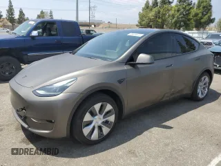 2022 Tesla Model Y Long Range z VIN 7SAYGDEE3NF518397, wystawiony jako Copart lot #55614675 z przebiegiem 16 230 mil mil oraz Szkoda całkowita • Salvage title. Historia ofert i sprzedaży dostępna na DreamBid. Obrazek 1.