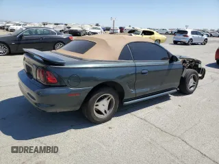 1998 Ford Mustang with VIN 1FAFP4447WF156297, listed as a Copart auction lot 60757265 with 61,296 mi miles and Salvage title. Bid and sale history available at DreamBid. Image 3.