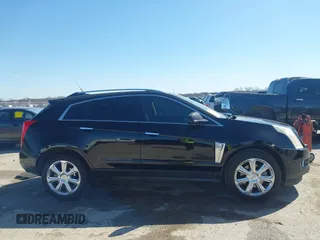 2014 Cadillac SRX Performance Collection z VIN 3GYFNCE35ES517868, wystawiony jako IAAI lot #41775522 z przebiegiem 166 960 mil mil oraz . Historia ofert i sprzedaży dostępna na DreamBid. Obrazek 13.
