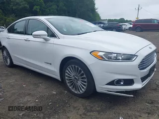 2013 Ford Fusion Titanium Hybrid with VIN 3FA6P0RU6DR315585, listed as a IAAI auction lot 42598359 with 153,669 mi miles and . Bid and sale history available at DreamBid. Image 1.
