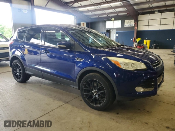 2013 Ford Escape SEL z VIN 1FMCU9HX7DUC87287, wystawiony jako Copart lot #61798475 z przebiegiem 147 521 mil mil oraz Czysty tytuł • Clean title. Historia ofert i sprzedaży dostępna na DreamBid. Obrazek 4.