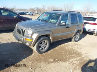 2004 Jeep Liberty Limited with VIN 1J4GL58K14W241524, listed as a IAAI auction lot 41822169 with 136,090 mi miles. Bid and sale history available at carsss.com. Image 2.