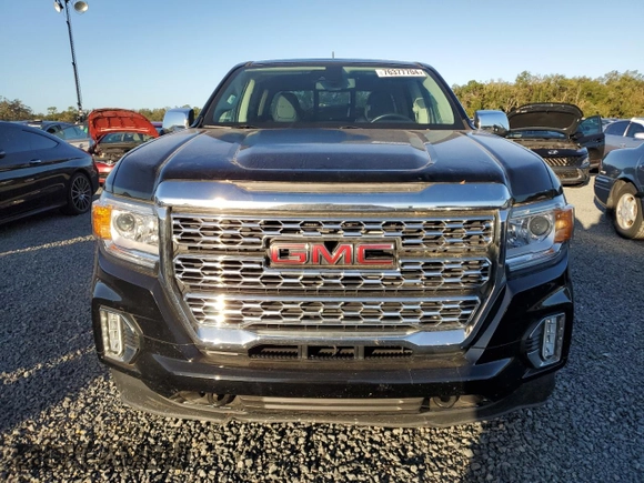 2021 GMC Canyon 2WD Denali with VIN 1GTG5EEN2M1107052, listed as a Copart auction lot 76377704 with 11,696 mi miles and Salvage Title. Bid and sale history available at carsss.com. Image 5.