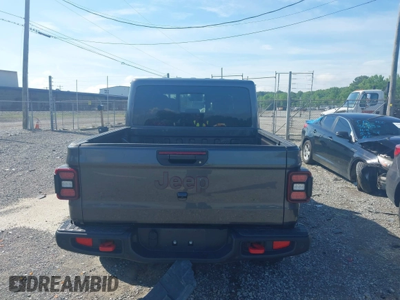 2021 Jeep Gladiator Rubicon z VIN 1C6JJTBG9ML592538, wystawiony jako IAAI lot #42206035 z przebiegiem 37 945 mil mil oraz . Historia ofert i sprzedaży dostępna na DreamBid. Obrazek 16.