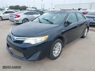 2013 Toyota Camry Hybrid LE with VIN 4T1BD1FK6DU070138, listed as a IAAI auction lot 41668658 with 148,065 mi miles. Bid and sale history available at carsss.com. Image 2.