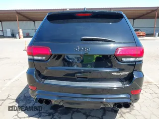 2020 Jeep Grand Cherokee Trackhawk with VIN 1C4RJFN96LC336561, listed as a IAAI auction lot 41991800 with 58,781 mi miles and . Bid and sale history available at DreamBid. Image 16.