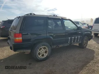 1998 Jeep Grand Cherokee Laredo with VIN 1J4GZ48YXWC299827, listed as a Copart auction lot 76898264 with 232,656 mi miles and Clean Title. Bid and sale history available at carsss.com. Image 3.
