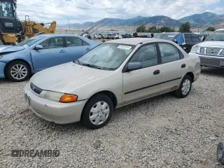 1998 Mazda Protege DX with VIN JM1BC1412W0181703, listed as a Copart auction lot 84111754 with 262,182 mi miles and Salvage Title. Bid and sale history available at DreamBid. Image 1.