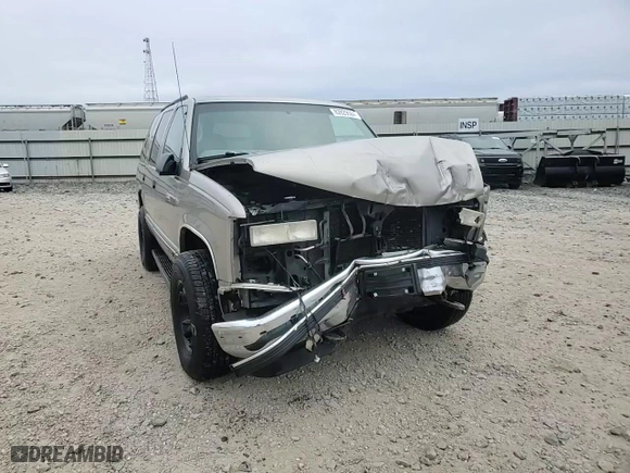 1999 GMC Yukon with VIN 1GKEK13R1XJ740648, listed as a Copart auction lot 82829084 with 211,002 mi miles and Salvage Title. Bid and sale history available at carsss.com. Image 12.