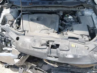 2014 Mazda CX-5 Sport with VIN JM3KE2BEXE0329303, listed as a IAAI auction lot 42556908 with 127,836 mi miles and . Bid and sale history available at DreamBid. Image 10.