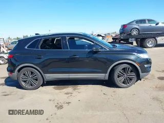 2015 Lincoln MKC with VIN 5LMTJ2AH6FUJ13505, listed as a IAAI auction lot 41871254 with 107,924 mi miles. Bid and sale history available at carsss.com. Image 13.