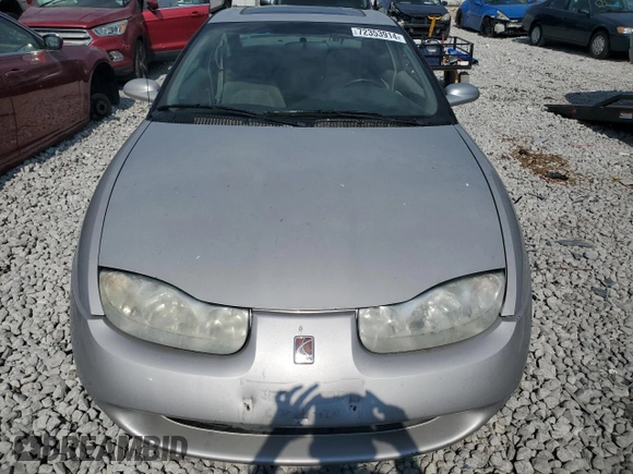 2001 Saturn SC z VIN 1G8ZR12711Z109068, wystawiony jako Copart lot #72353914 z przebiegiem 116 559 mil mil oraz Szkody całkowita. Historia ofert i sprzedaży dostępna na DreamBid. Obrazek 5.