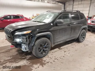 2017 Jeep Cherokee Trailhawk with VIN 1C4PJMBS8HW648454, listed as a IAAI auction lot 41094103 with 125,941 mi miles. Bid and sale history available at carsss.com. Image 18.
