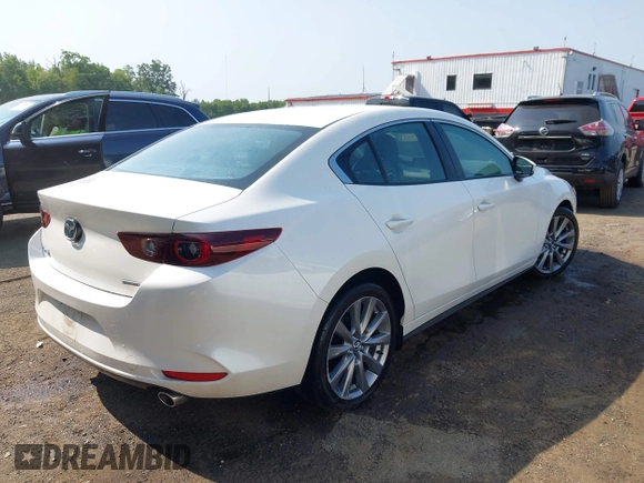 2022 Mazda 3 Carbon Edition with VIN 3MZBPACL0NM318573, listed as a IAAI auction lot 42403393 with 8,762 mi miles and . Bid and sale history available at DreamBid. Image 4.