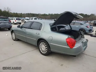 2004 Lincoln Town Car Signature with VIN 1LNHM81W34Y607067, listed as a Copart auction lot 42413965 with 106,973 mi miles and Salvage Title. Bid and sale history available at carsss.com. Image 2.