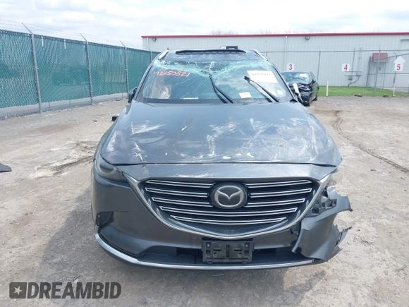 2016 Mazda CX-9 Grand Touring with VIN JM3TCBDY3G0117802, listed as a IAAI auction lot 42150821 with 157,760 mi miles and . Bid and sale history available at DreamBid. Image 12.