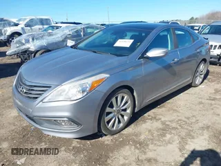 2016 Hyundai Azera Limited z VIN KMHFH4JGXGA568911, wystawiony jako IAAI lot #41428434 z przebiegiem 158 202 mil mil oraz . Historia ofert i sprzedaży dostępna na DreamBid. Obrazek 2.