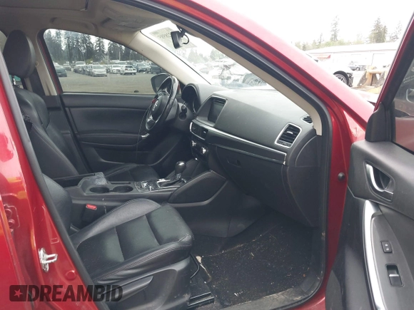 2016 Mazda CX-5 Grand Touring z VIN JM3KE4DY7G0687318, wystawiony jako IAAI lot #42228585 z przebiegiem 188 793 mil mil oraz . Historia ofert i sprzedaży dostępna na DreamBid. Obrazek 5.