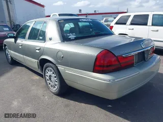 2004 Mercury Grand Marquis GS with VIN 2MEFM74W74X678515, listed as a IAAI auction lot 41916962 with 121,789 mi miles. Bid and sale history available at carsss.com. Image 3.