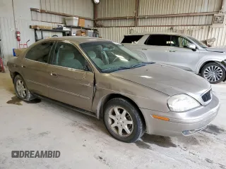 2002 Mercury Sable GS z VIN 1MEFM50U02G652804, wystawiony jako Copart lot #57405035 z przebiegiem 264 042 mil mil oraz Szkody całkowita. Historia ofert i sprzedaży dostępna na DreamBid. Obrazek 4.