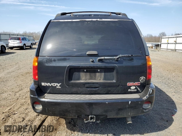 2003 GMC Envoy SLT z VIN 1GKET16PX36243554, wystawiony jako Copart lot #49083975 z przebiegiem 148 596 mil mil oraz Szkoda całkowita • Salvage title. Historia ofert i sprzedaży dostępna na DreamBid. Obrazek 6.