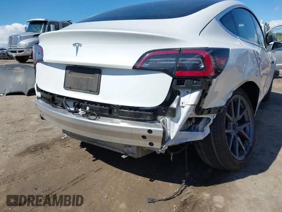 2020 Tesla Model 3 Standard Range Plus with VIN 5YJ3E1EA4LF644967, listed as a IAAI auction lot 41745984 with 23,479 mi miles and . Bid and sale history available at DreamBid. Image 6.