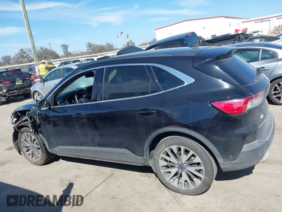 2020 Ford Escape Titanium Hybrid with VIN 1FMCU0DZ9LUC08090, listed as a IAAI auction lot 41674697 with 43,586 mi miles and . Bid and sale history available at DreamBid. Image 14.